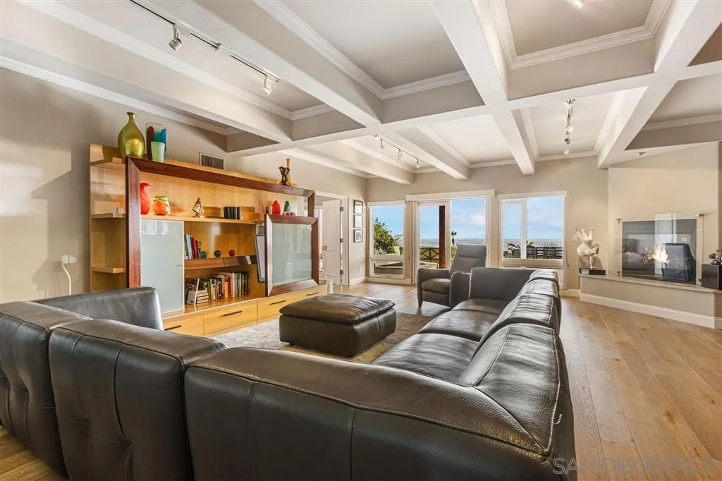 931 La Jolla Rancho Road La Jolla, CA 92037 - Photo 22 of 25 a living room with furniture and a chandelier