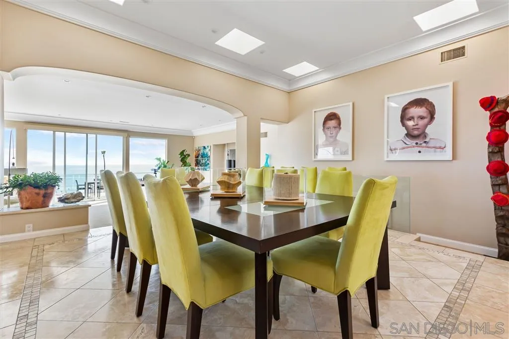 931 La Jolla Rancho Road La Jolla, CA 92037 - Photo 6 of 25 a view of a dining room with furniture and a large window