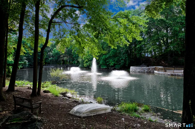 a sign board with a small garden
