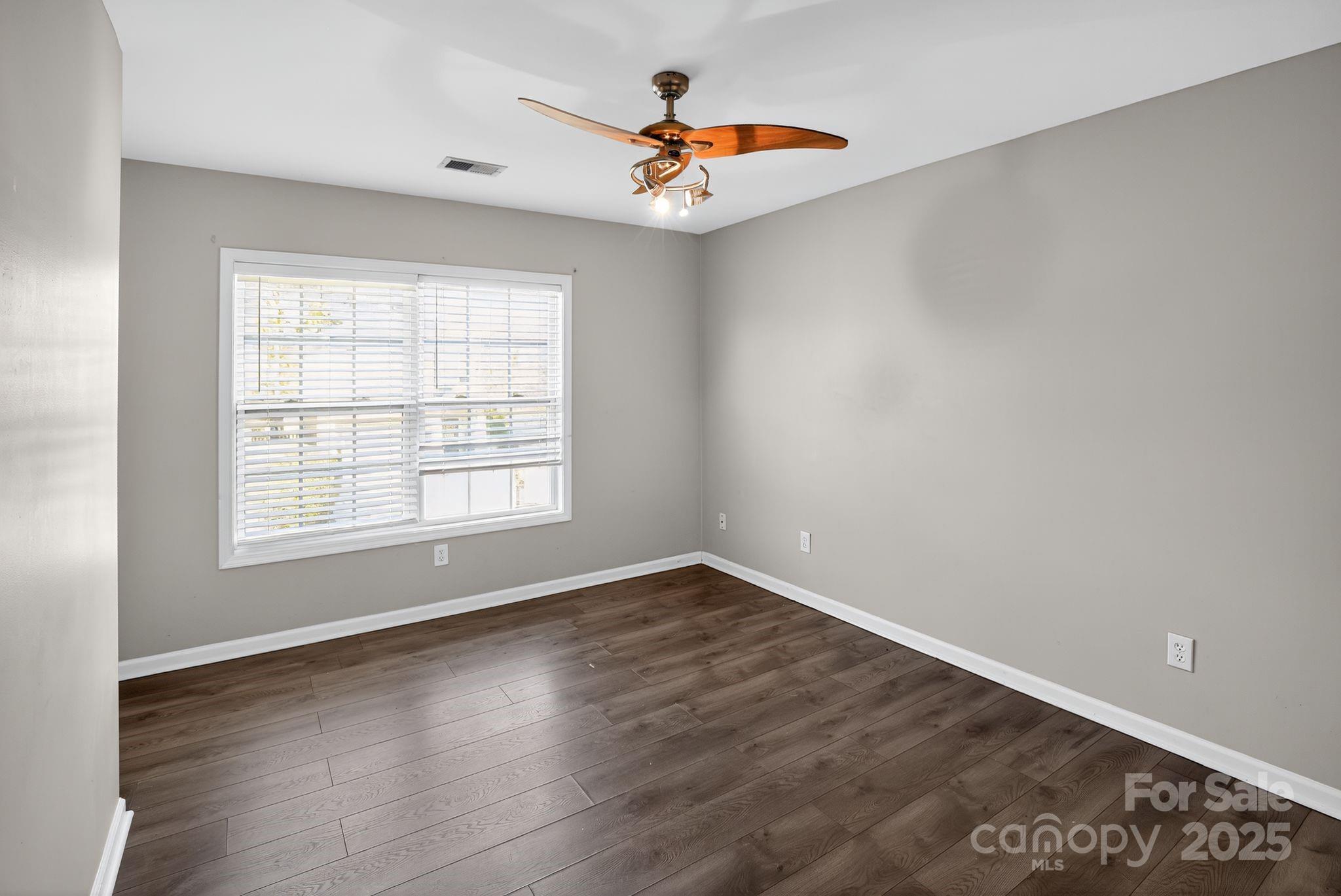 105 Whitton Court Lexington, SC 29073 - Photo 11 of 33 wooden floor in an empty room with a window