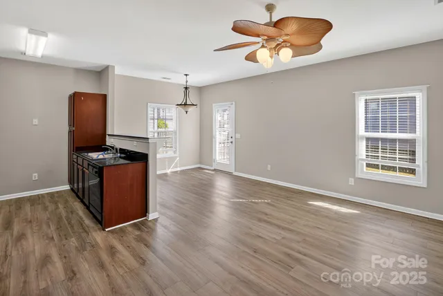 a kitchen with stainless steel appliances granite countertop a refrigerator and a stove