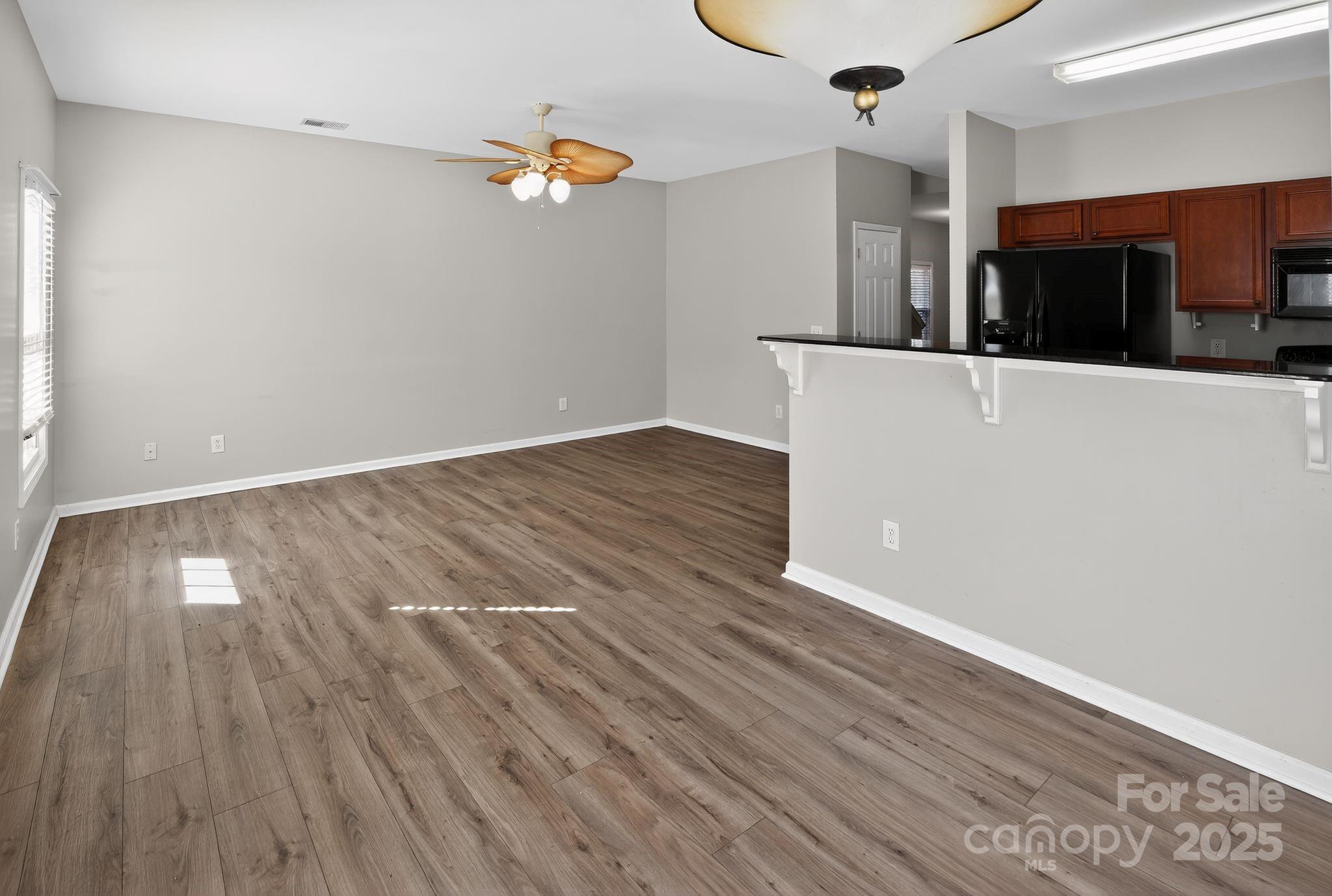 105 Whitton Court Lexington, SC 29073 - Photo 18 of 33 a view of a kitchen with wooden floor and electronic appliances