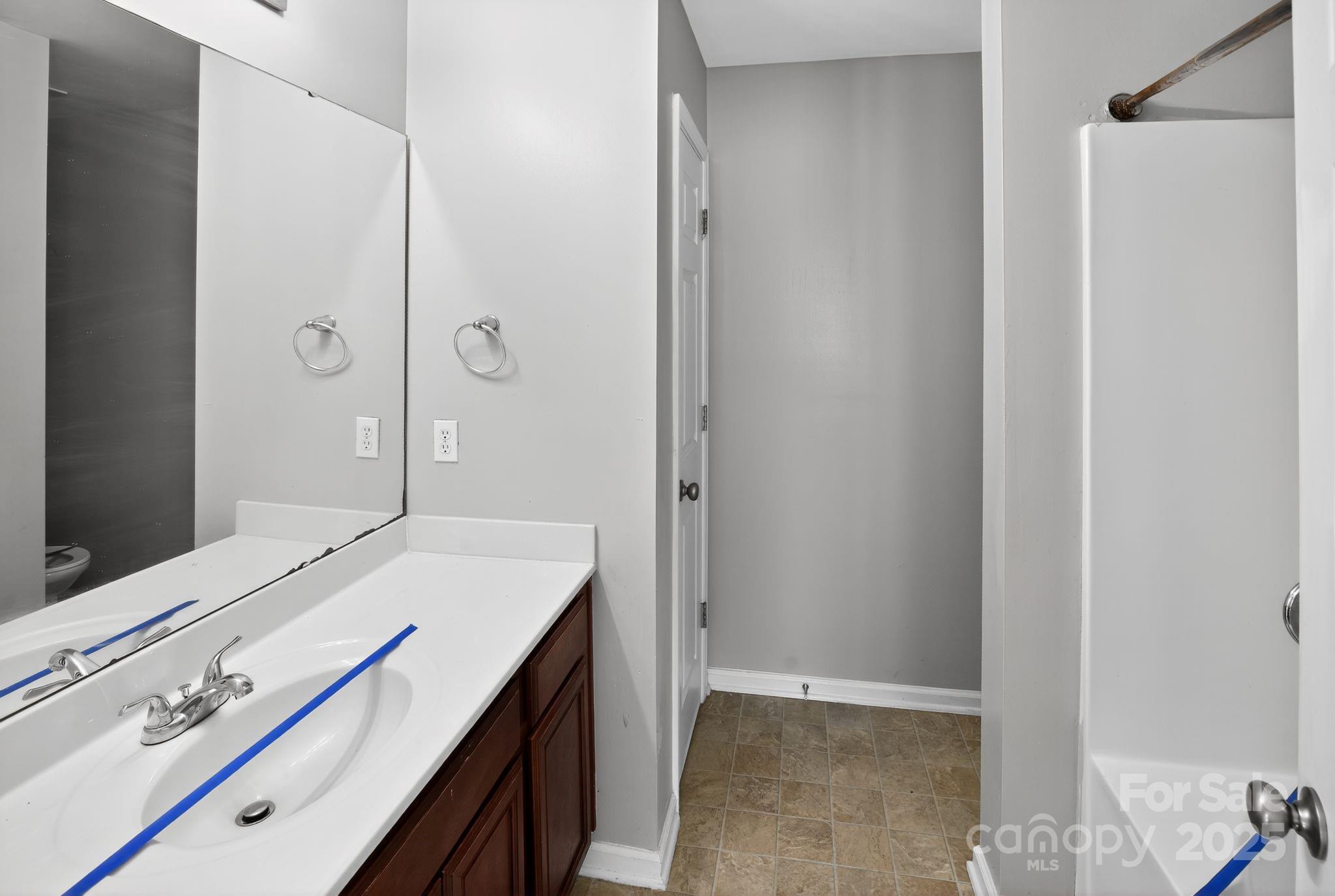 105 Whitton Court Lexington, SC 29073 - Photo 23 of 33 a spacious bathroom with a granite countertop sink a mirror and shower