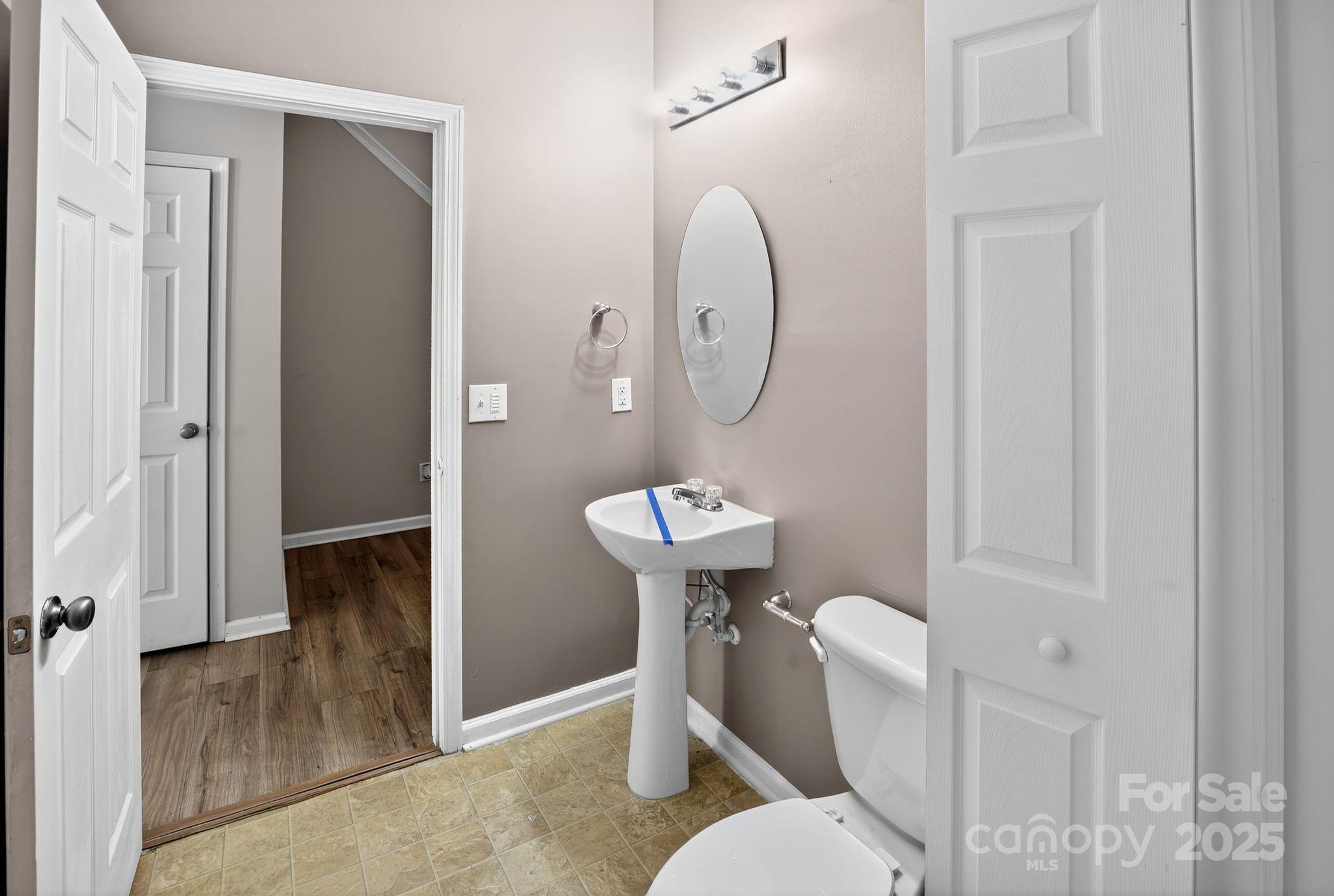 105 Whitton Court Lexington, SC 29073 - Photo 24 of 33 a bathroom with a toilet a sink and a mirror
