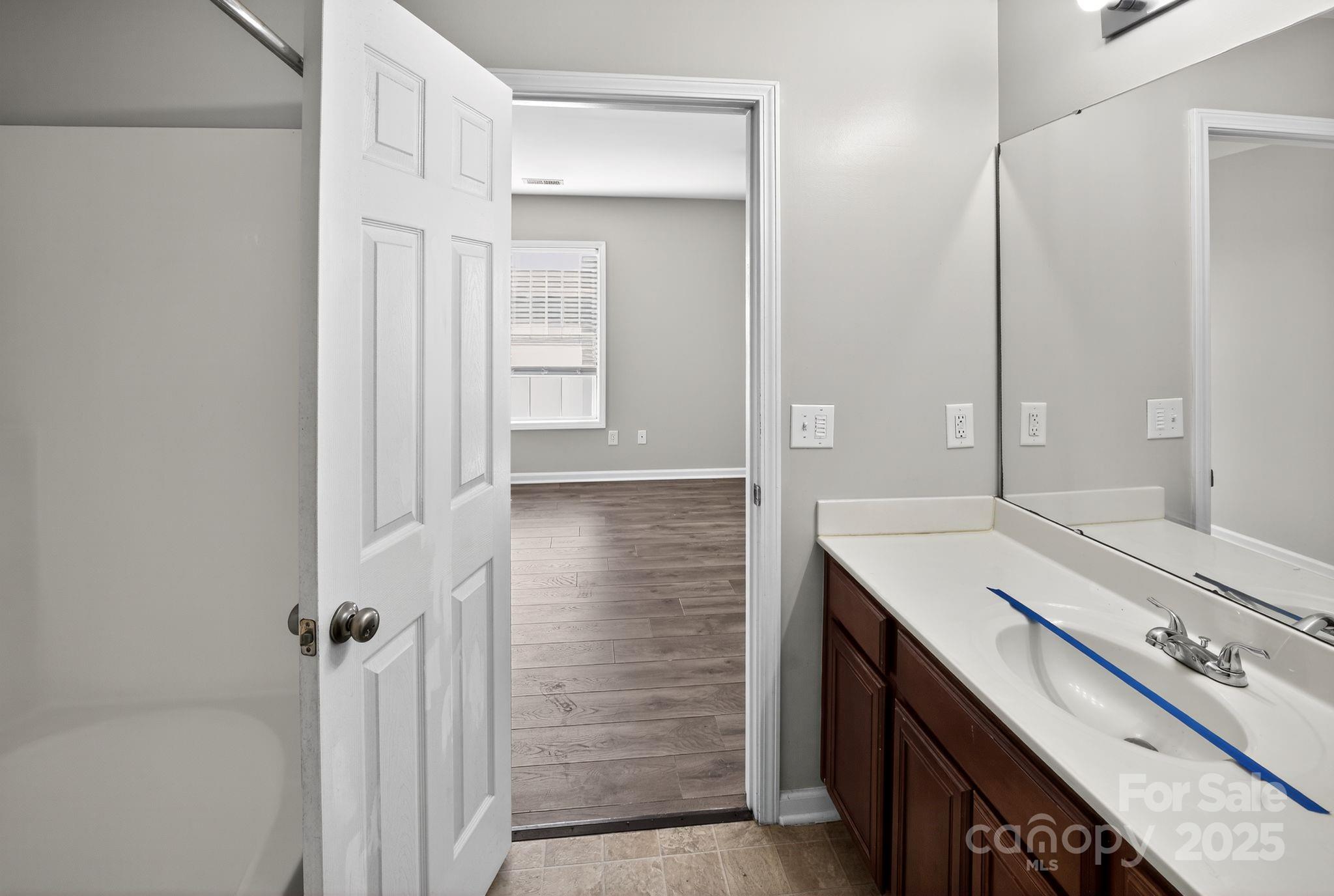 105 Whitton Court Lexington, SC 29073 - Photo 27 of 33 a bathroom with a sink and a mirror
