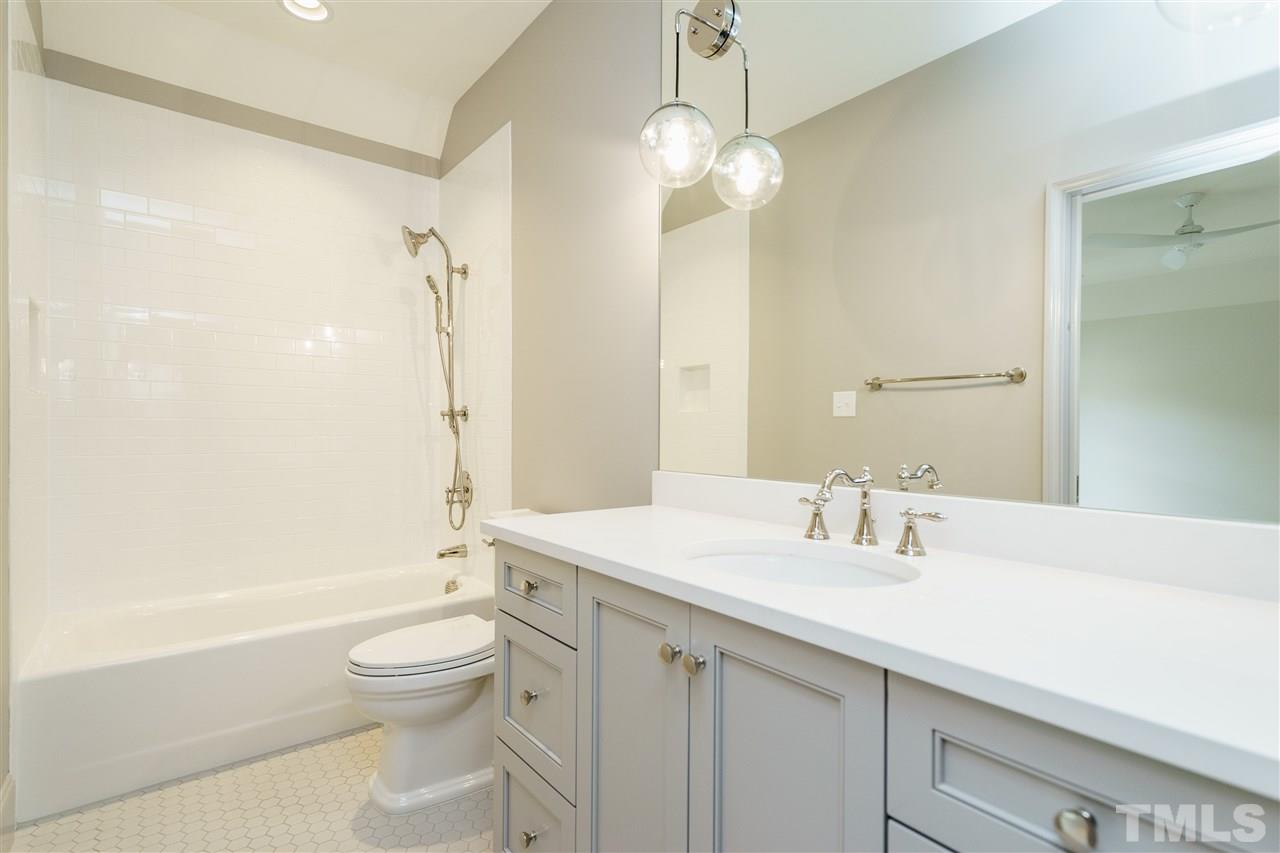2129 Cowper Drive Raleigh, NC 27608 - Photo 24 of 25 a bathroom with a sink a toilet and shower
