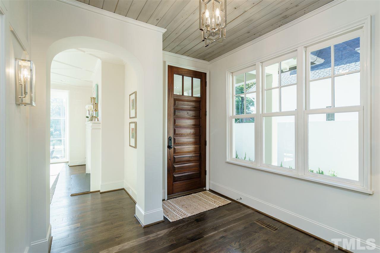 2129 Cowper Drive Raleigh, NC 27608 - Photo 4 of 25 wooden floor in an empty room with a window
