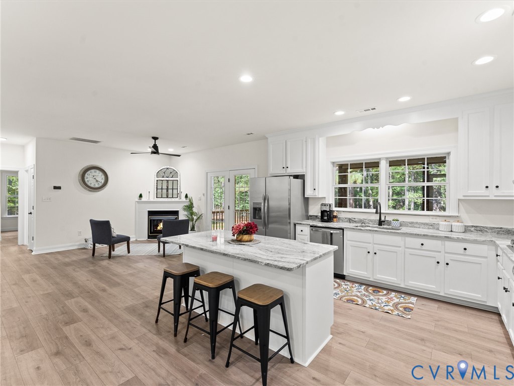 12 Henderson Road New Canton, VA 23123 - Photo 18 of 49 Open-concept living area featuring wood-finish flo