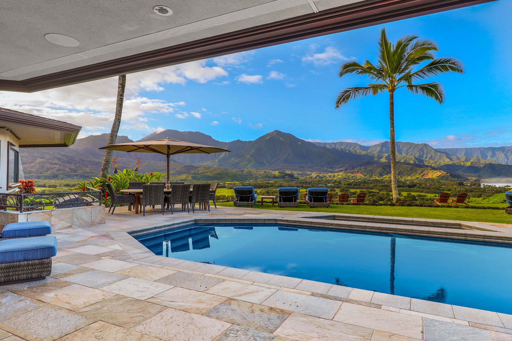 4971 Hanalei Plantation Road Princeville, HI 96722 - Photo 21 of 30 a view of swimming pool with a table and chairs under an umbrella