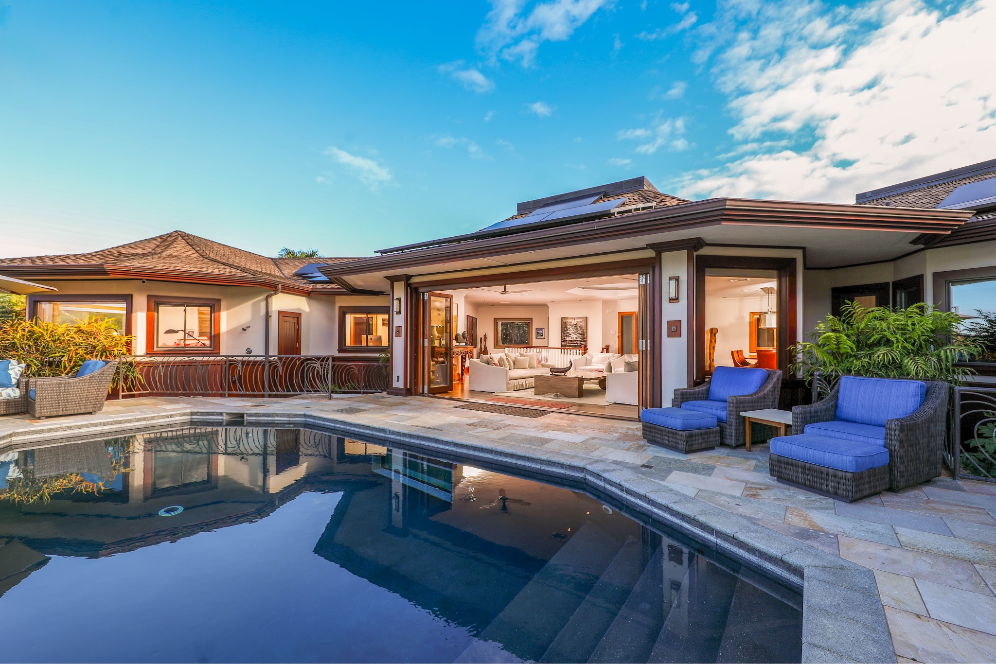 4971 Hanalei Plantation Road Princeville, HI 96722 - Photo 8 of 30 a view of a house with a swimming pool and furniture