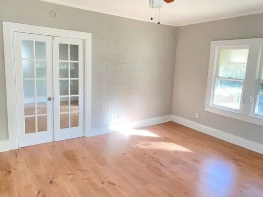 an empty room with a empty space and windows