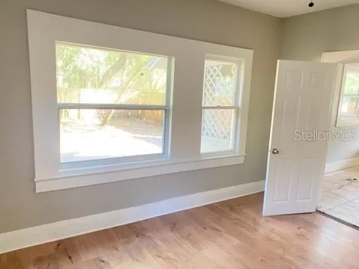 a view of an empty room with a window