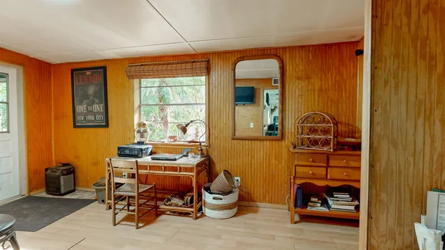 a view of a livingroom with furniture and window
