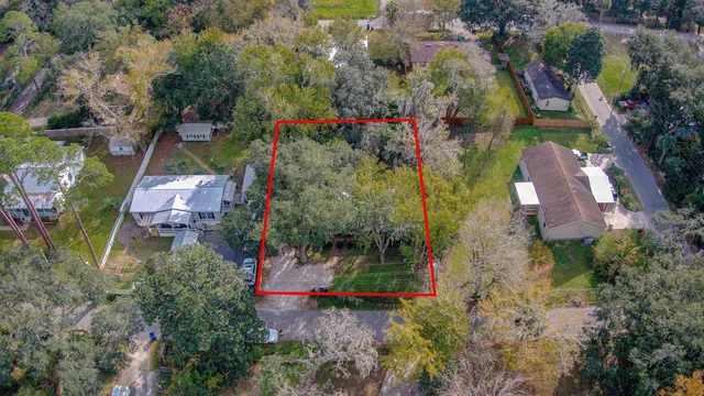 an aerial view of residential house with outdoor space and swimming pool