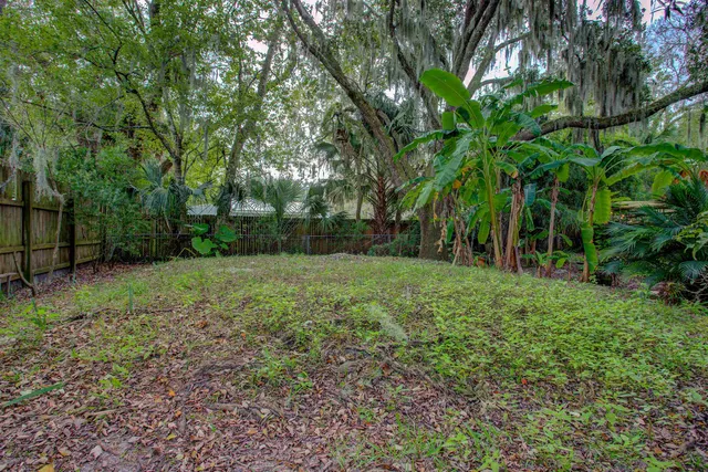 a backyard of a house with a barn swing and couches chair