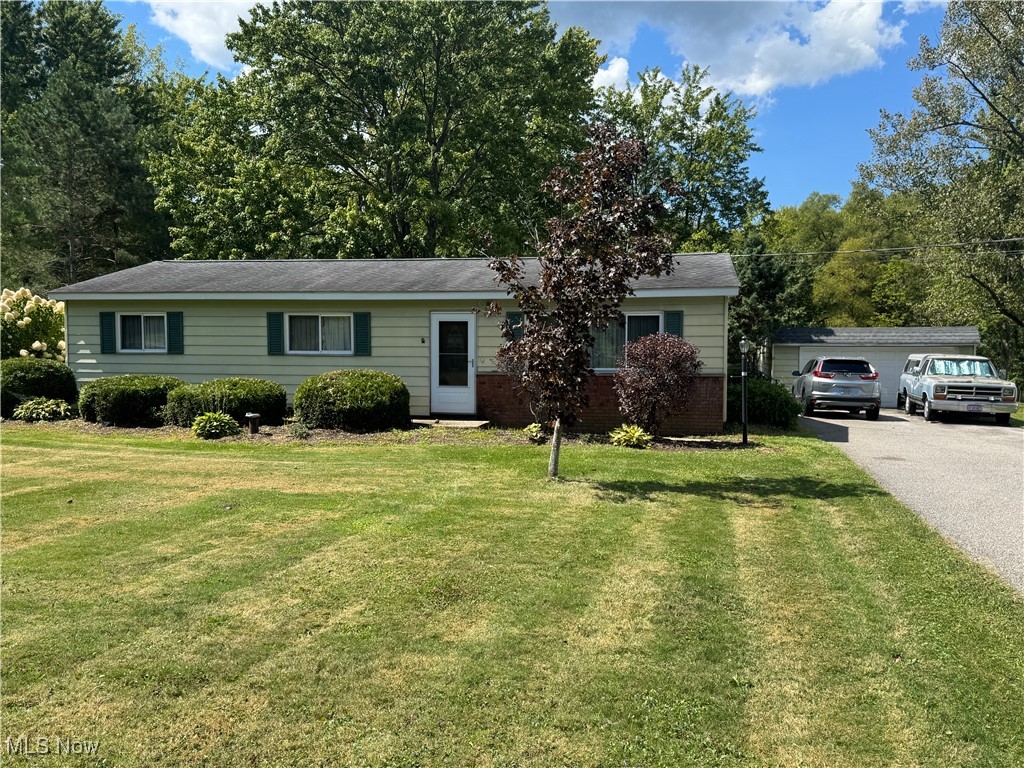 8810 Auburn Road Chardon, OH 44024 - Photo 22 of 22 Ranch-style home with a front lawn and brick siding