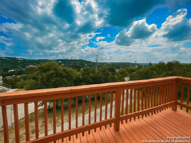 412 Moonlight Walk San Antonio, TX 78260 - Photo 11 of 26 a view of a balcony with wooden fence