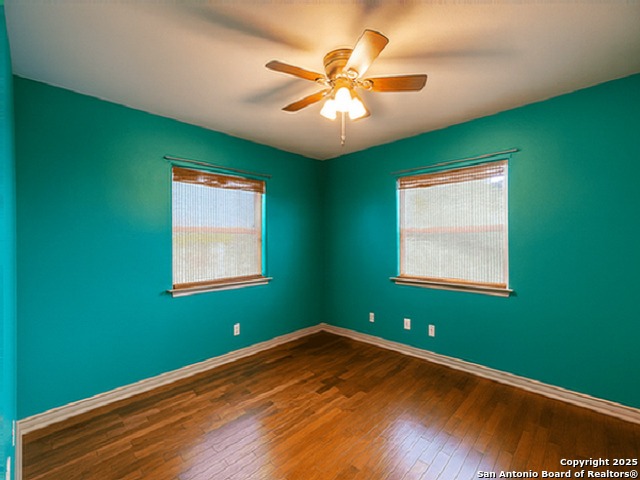 412 Moonlight Walk San Antonio, TX 78260 - Photo 15 of 26 a view of an empty room with window and chandelier fan