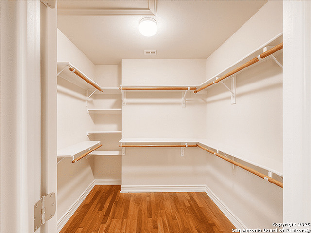412 Moonlight Walk San Antonio, TX 78260 - Photo 16 of 26 a view of a room with wooden floor and white walls