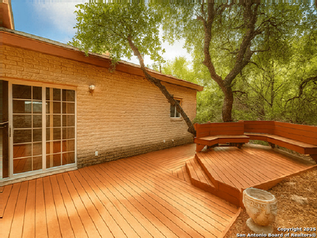 412 Moonlight Walk San Antonio, TX 78260 - Photo 20 of 26 a backyard of a house with wooden floor and fence