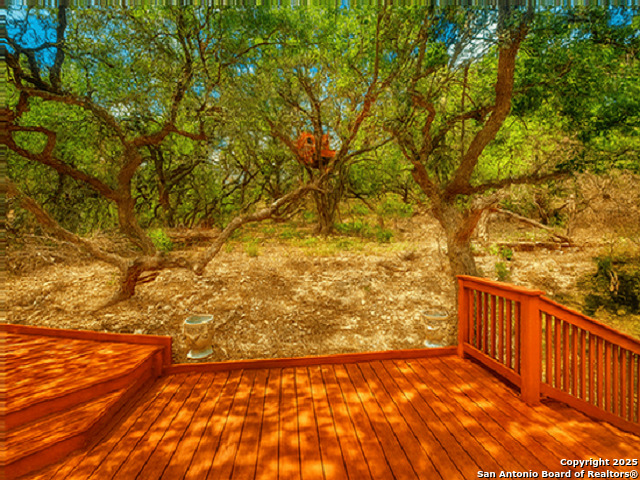 412 Moonlight Walk San Antonio, TX 78260 - Photo 21 of 26 a view of a yard with wooden fence and a bench