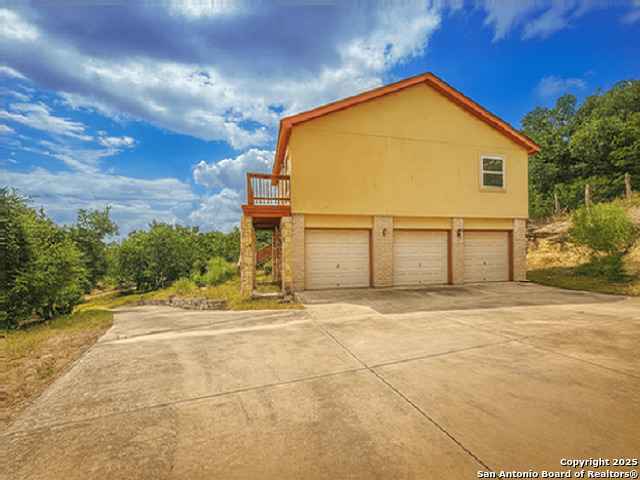 412 Moonlight Walk San Antonio, TX 78260 - Photo 24 of 26 a view of a house with a street