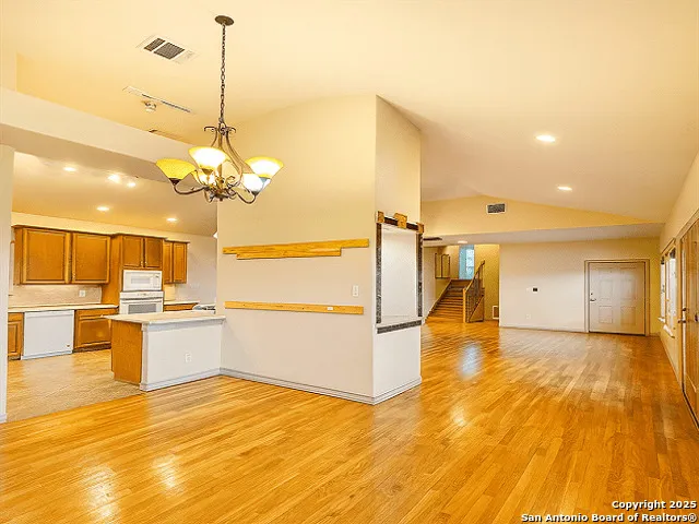 a view of a kitchen with a sink and microwave