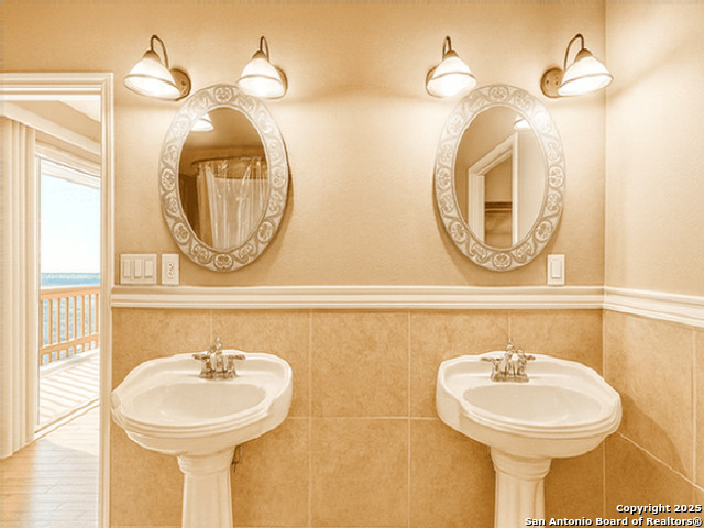 412 Moonlight Walk San Antonio, TX 78260 - Photo 10 of 26 a bathroom with a sink and a mirror