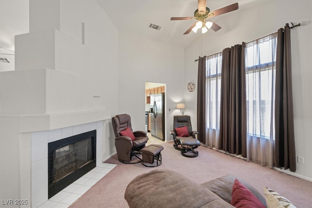 130 Park Ridge Lane Henderson, NV 89002 - Photo 7 of 69 Sitting room featuring carpet, ceiling fan, a tile