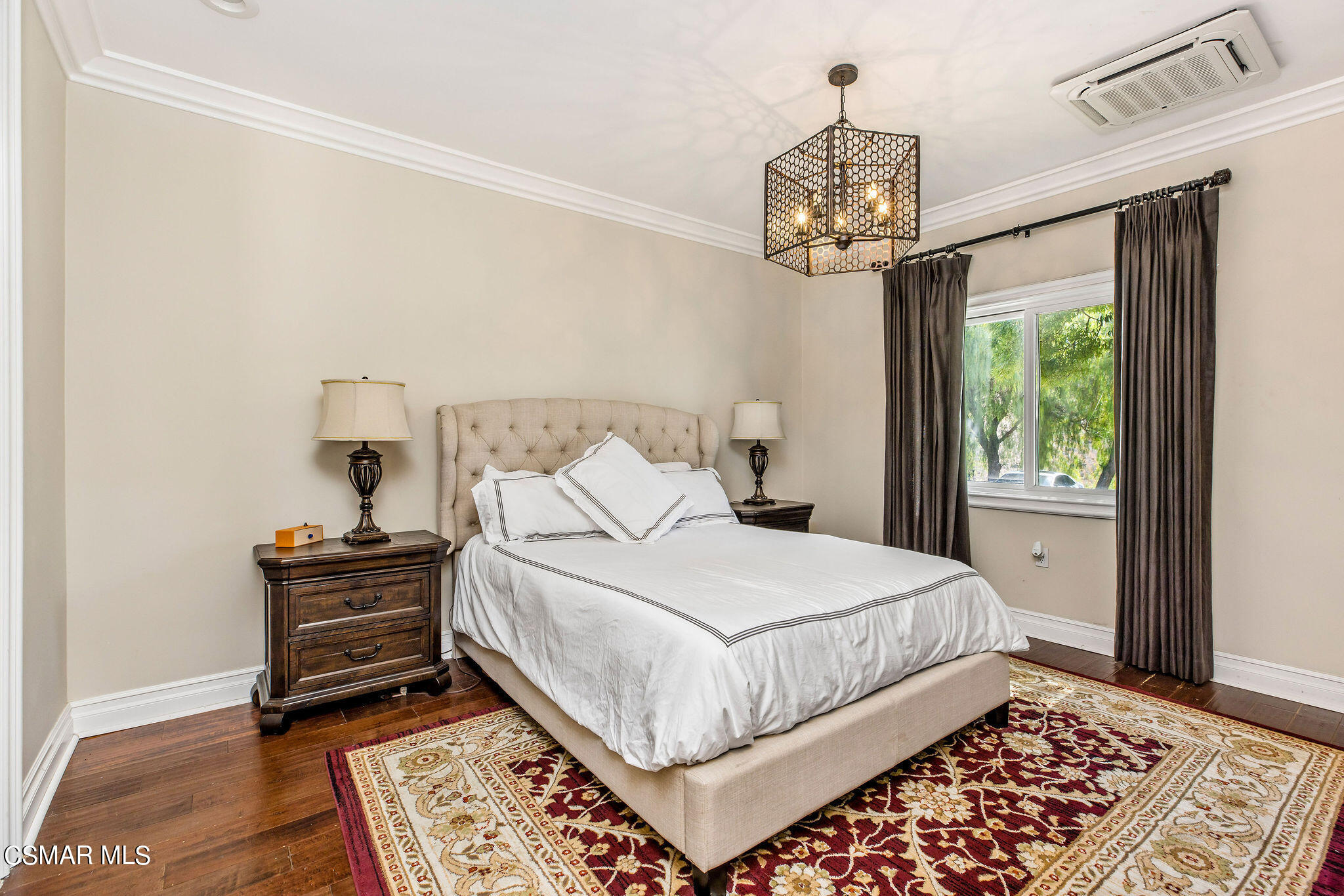 15660 LaPeyre Road Moorpark, CA 93021 - Photo 11 of 84 a bedroom with a bed and a chandelier