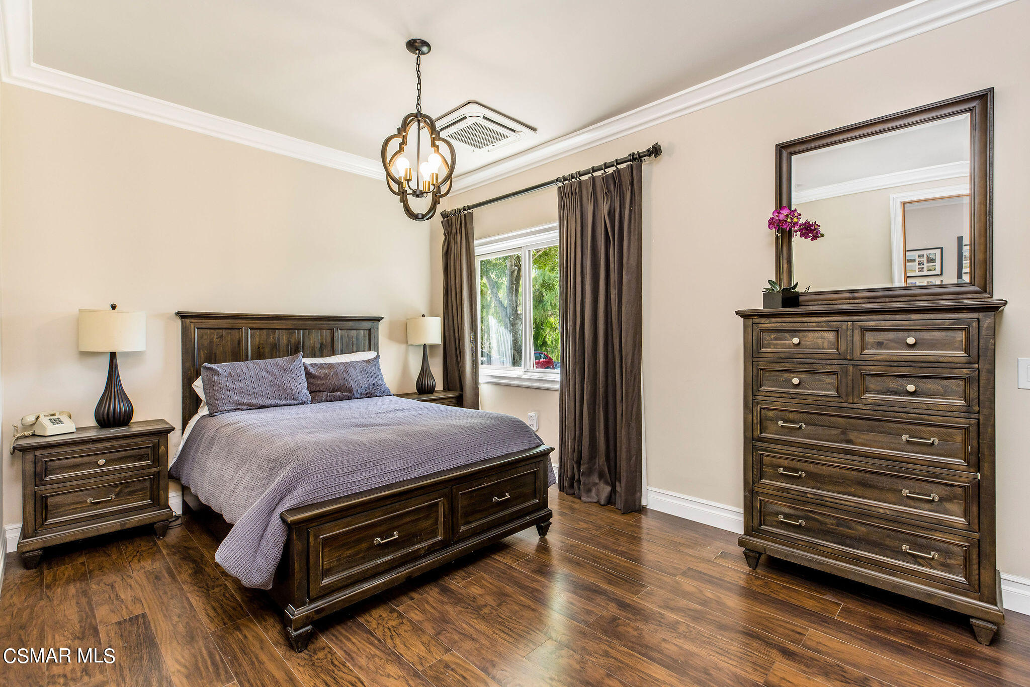 15660 LaPeyre Road Moorpark, CA 93021 - Photo 12 of 84 a bedroom with a bed and a chandelier