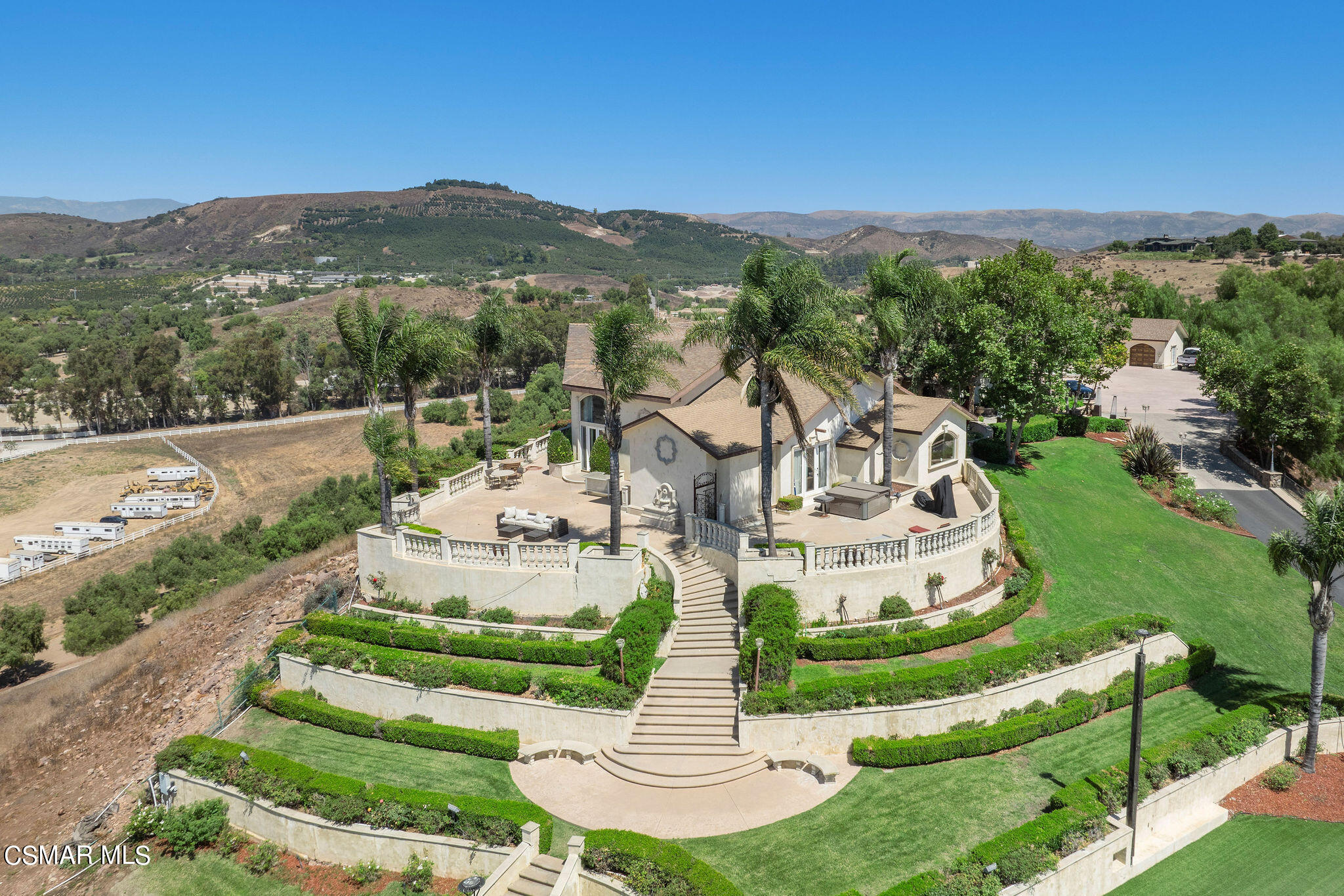 15660 LaPeyre Road Moorpark, CA 93021 - Photo 2 of 84 a view of a white house with a big yard and large tree