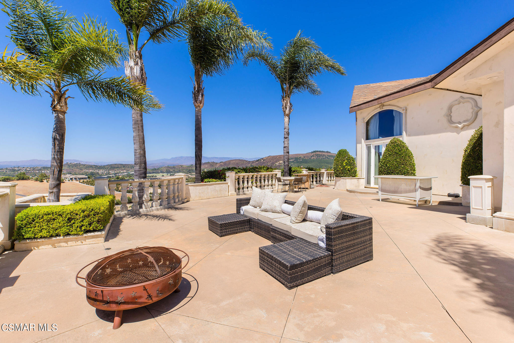 15660 LaPeyre Road Moorpark, CA 93021 - Photo 34 of 84 a view of a backyard with couches and a potted plant