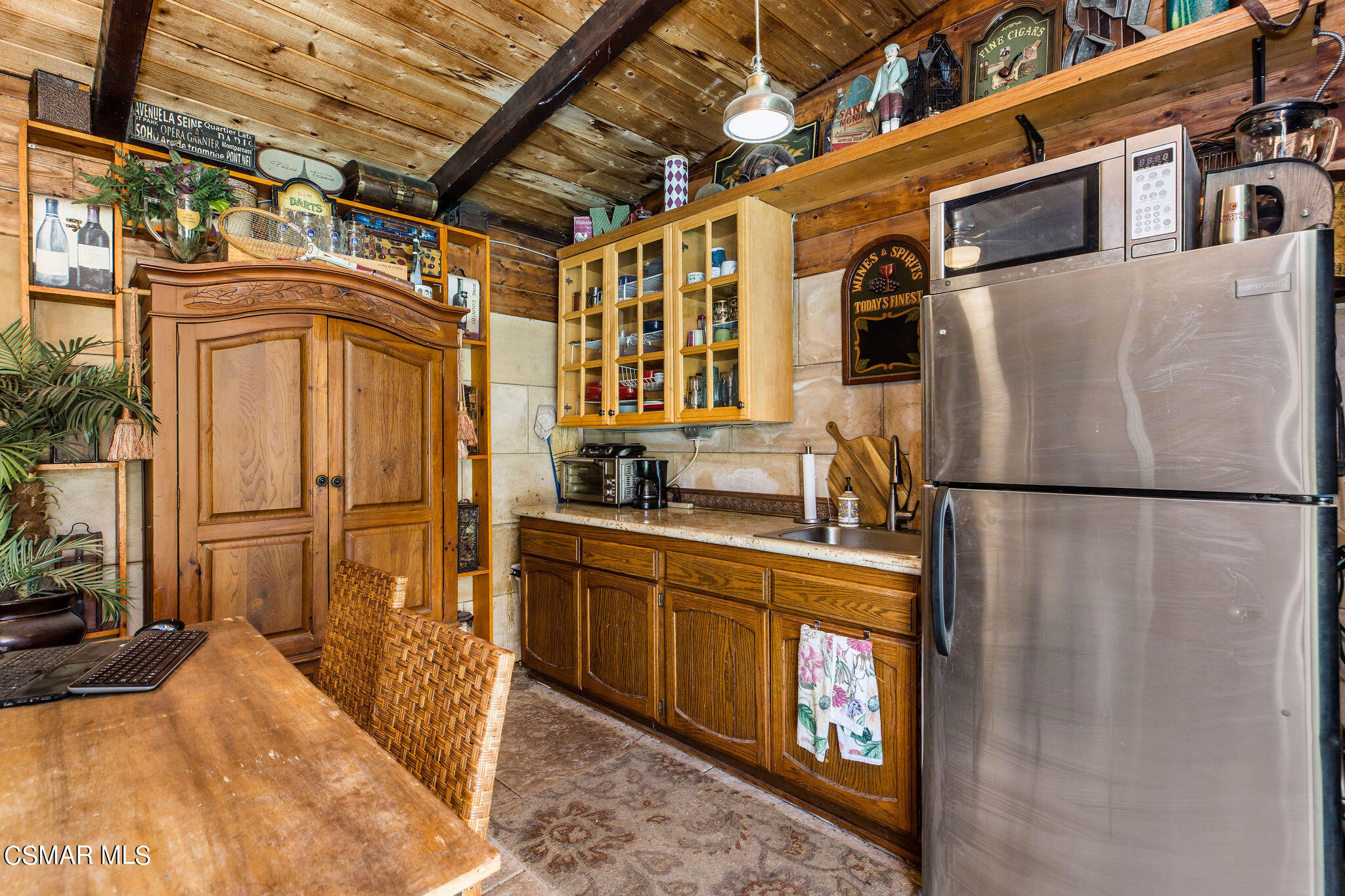 15660 LaPeyre Road Moorpark, CA 93021 - Photo 48 of 84 a kitchen with stainless steel appliances granite countertop a refrigerator a stove and a sink with granite countertops