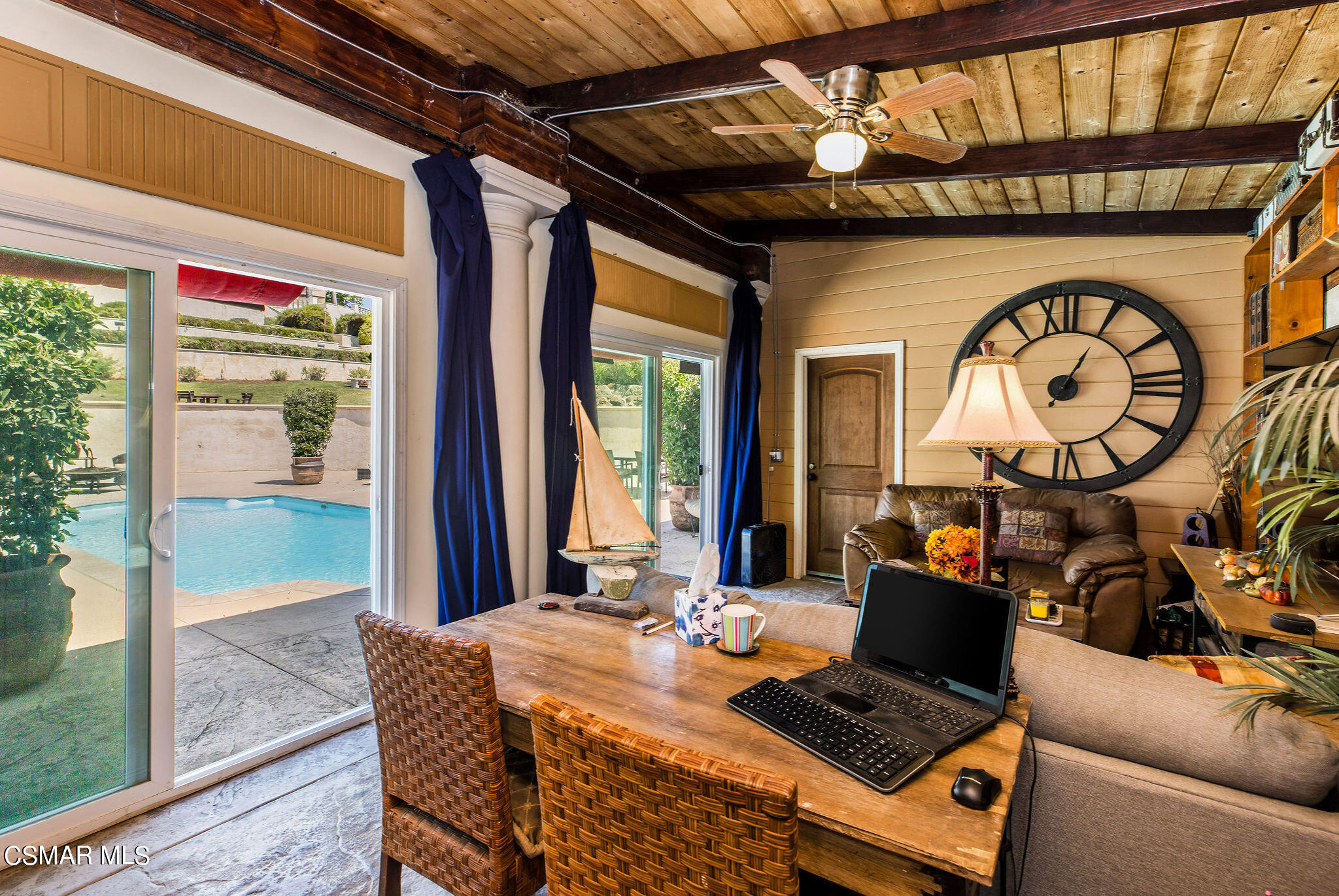 15660 LaPeyre Road Moorpark, CA 93021 - Photo 49 of 84 a living room with furniture a large window and a wooden floor