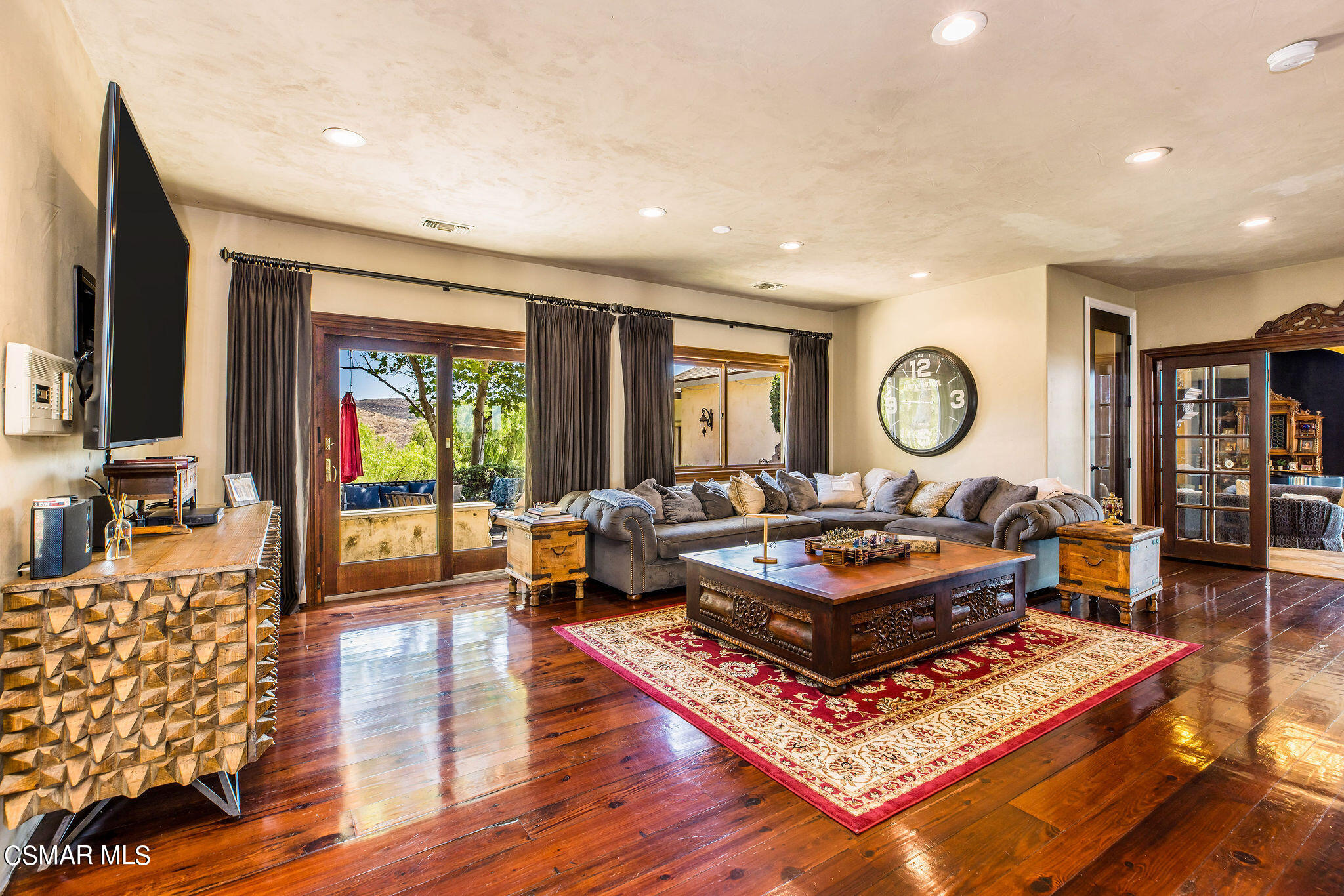 15660 LaPeyre Road Moorpark, CA 93021 - Photo 59 of 84 a living room with furniture and a flat screen tv