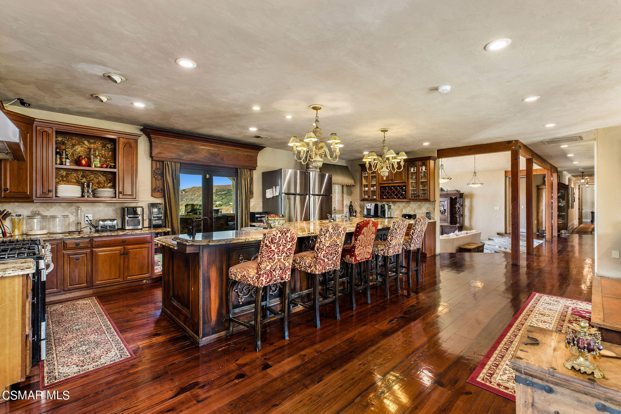 15660 LaPeyre Road Moorpark, CA 93021 - Photo 61 of 84 a large kitchen with lots of counter space and dining table