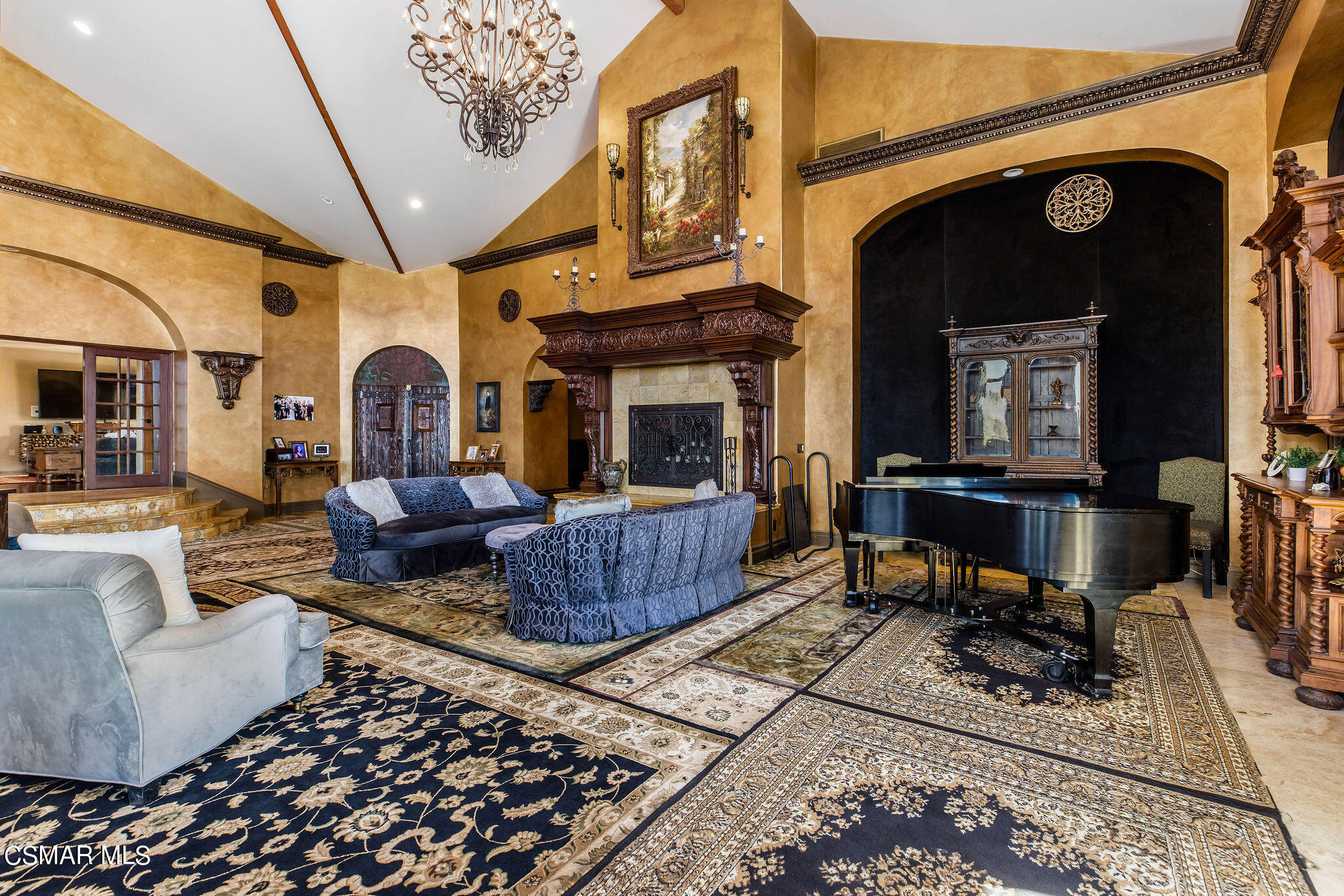 15660 LaPeyre Road Moorpark, CA 93021 - Photo 67 of 84 a living room with furniture a rug and a fireplace