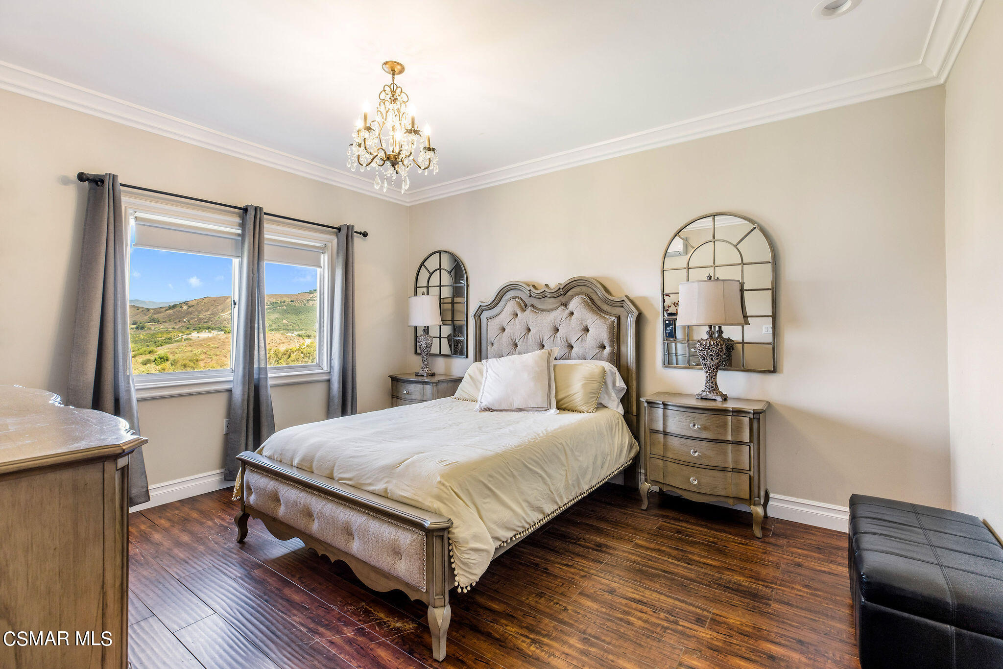 15660 LaPeyre Road Moorpark, CA 93021 - Photo 9 of 84 a bedroom with a bed and a chandelier