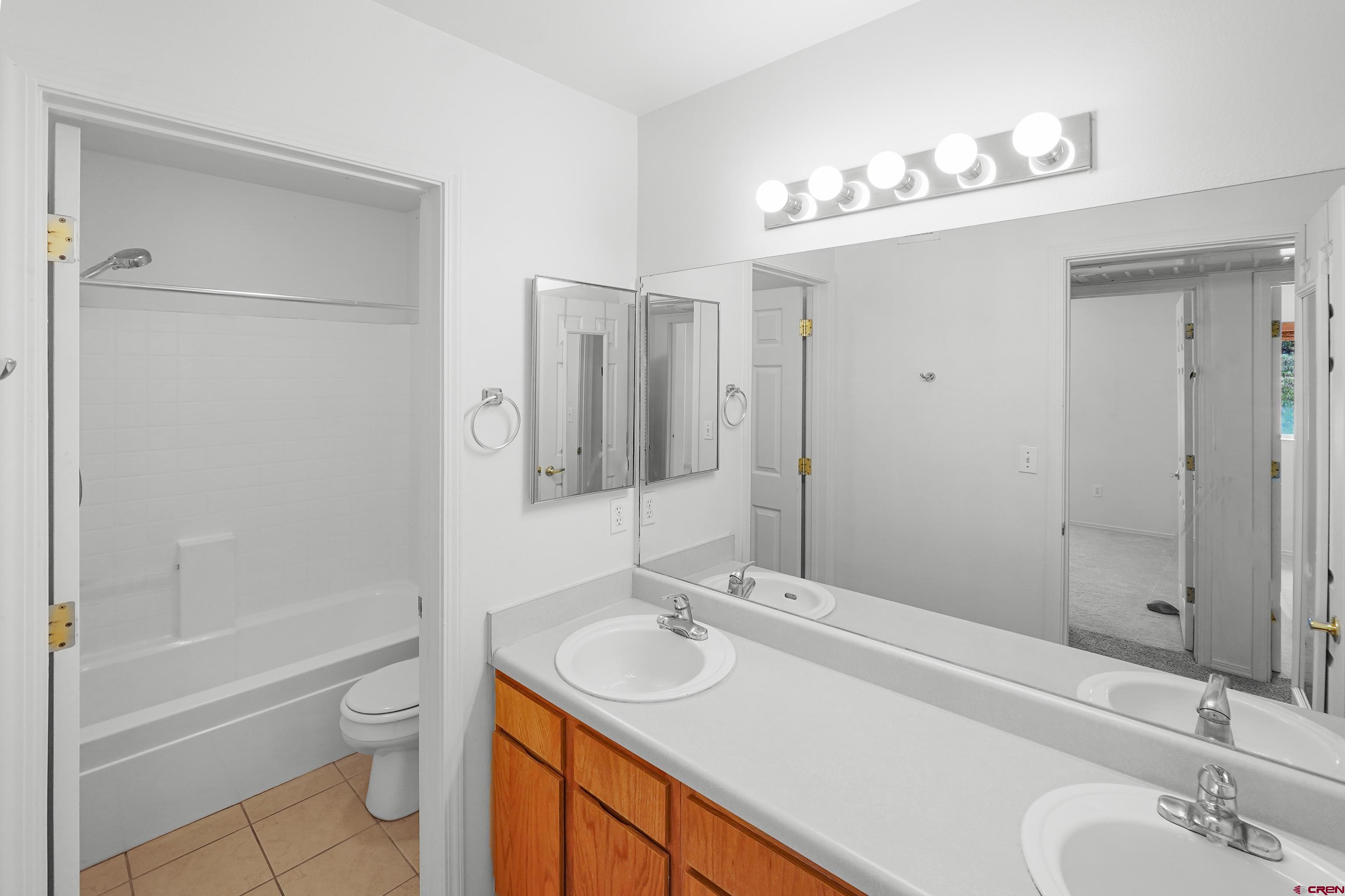 1100 Goeglein Gulch Road, Unit 163 Durango, CO 81301 - Photo 22 of 23 a bathroom with a sink a toilet and shower