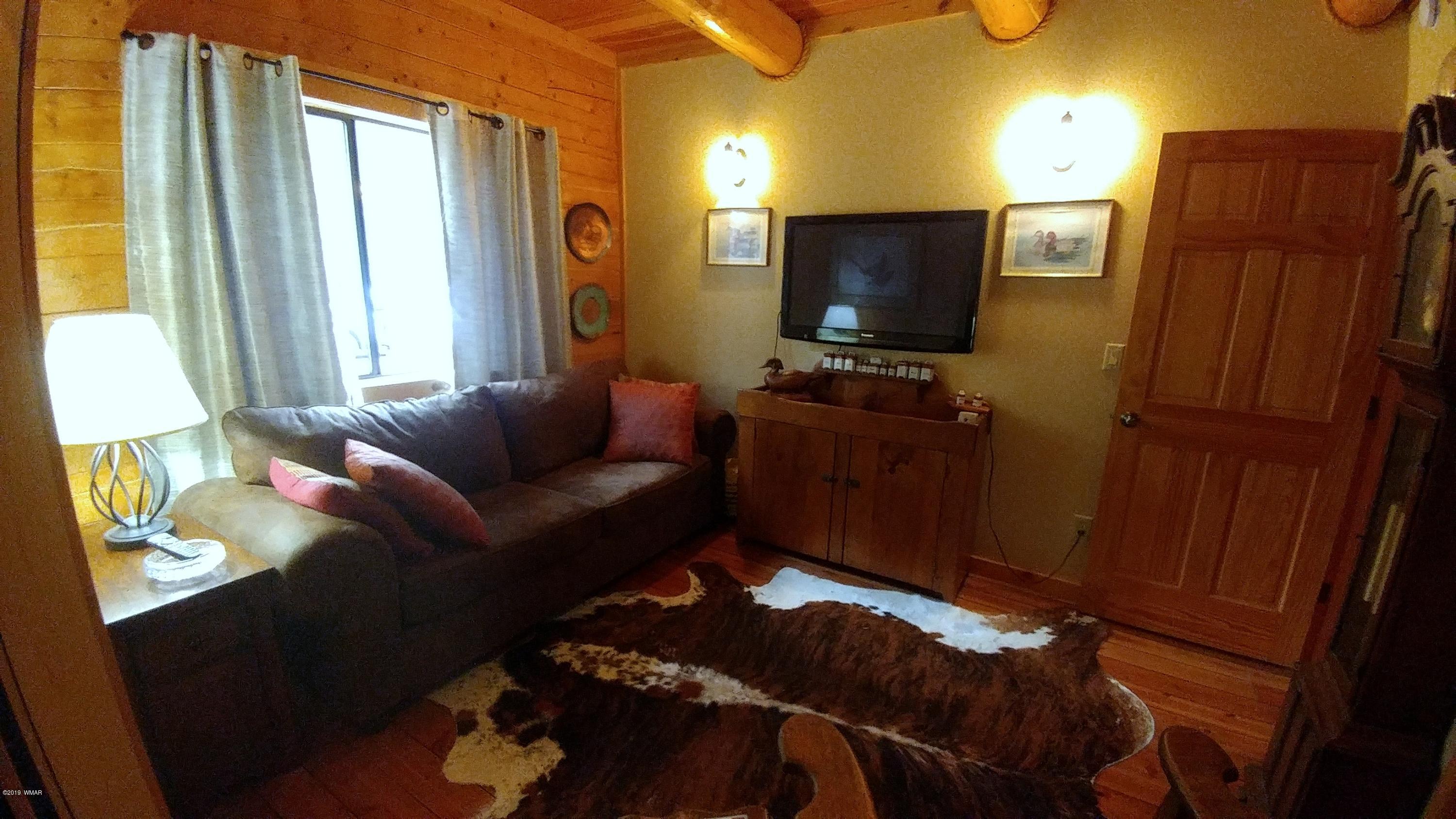2312 Overgaard Springs Loop Overgaard, AZ 85933 - Photo 33 of 54 a living room with furniture and a flat screen tv