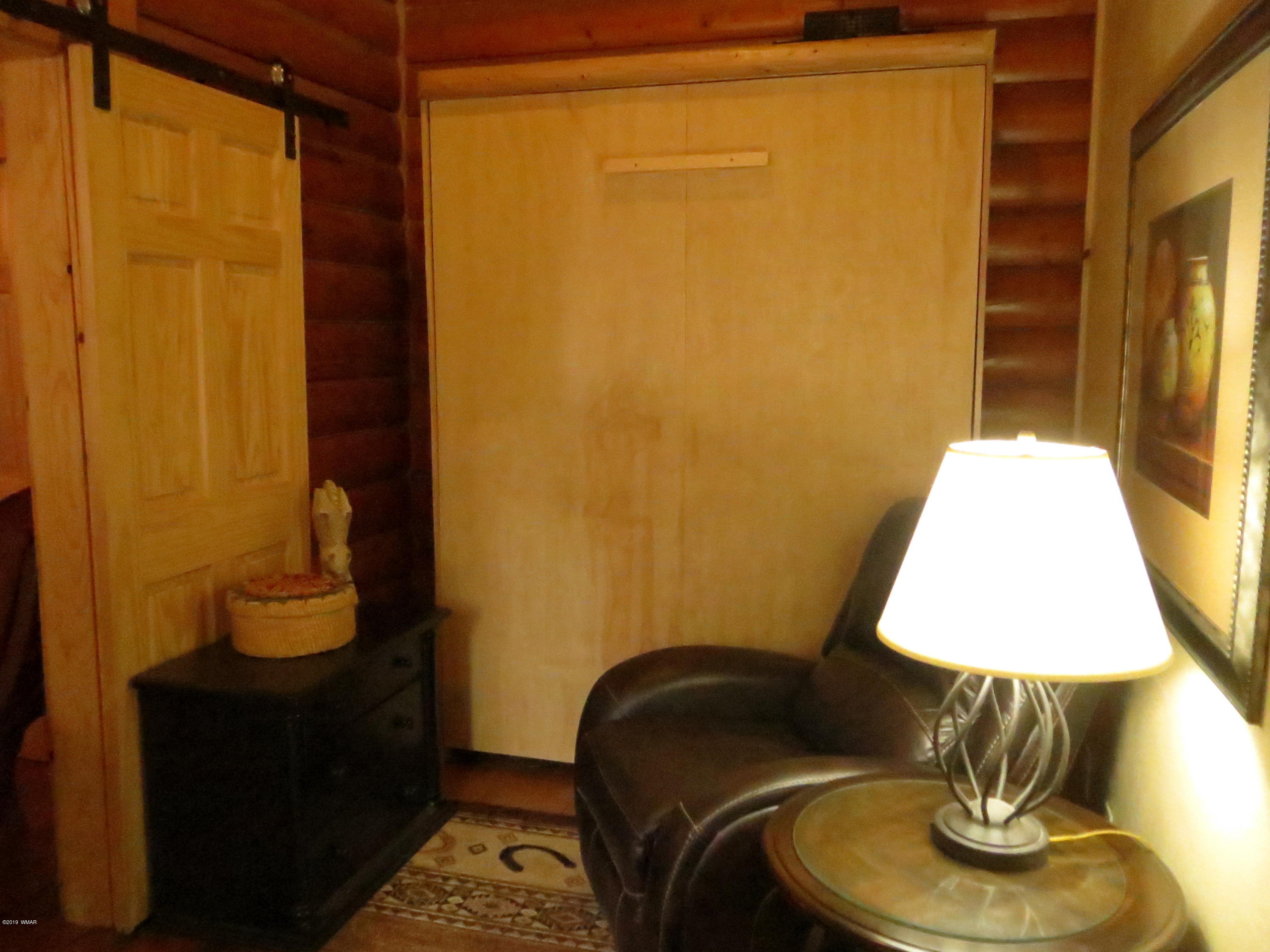 2312 Overgaard Springs Loop Overgaard, AZ 85933 - Photo 35 of 54 a room with a chair and table