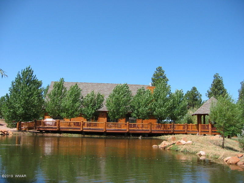 2312 Overgaard Springs Loop Overgaard, AZ 85933 - Photo 42 of 54 a view of a lake with houses