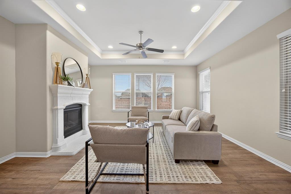 1815 Ladera Way, Unit 1815 Mansfield, TX 76063 - Photo 1 of 24 a living room with furniture a fireplace and a table
