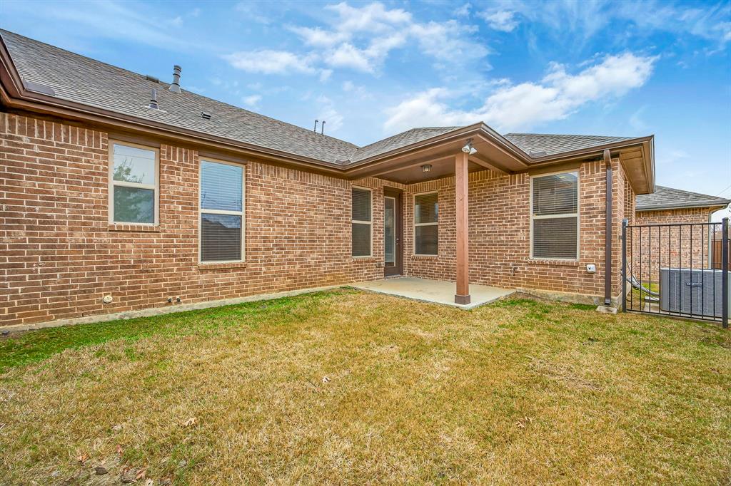 1815 Ladera Way, Unit 1815 Mansfield, TX 76063 - Photo 6 of 24 a front view of a house with a yard