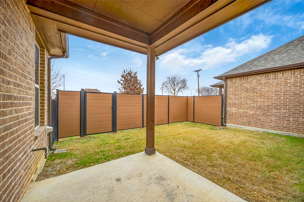 1815 Ladera Way, Unit 1815 Mansfield, TX 76063 - Photo 7 of 24 a view of backyard with large tree