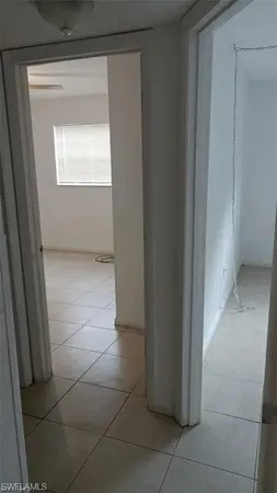 a view of an empty room and a window