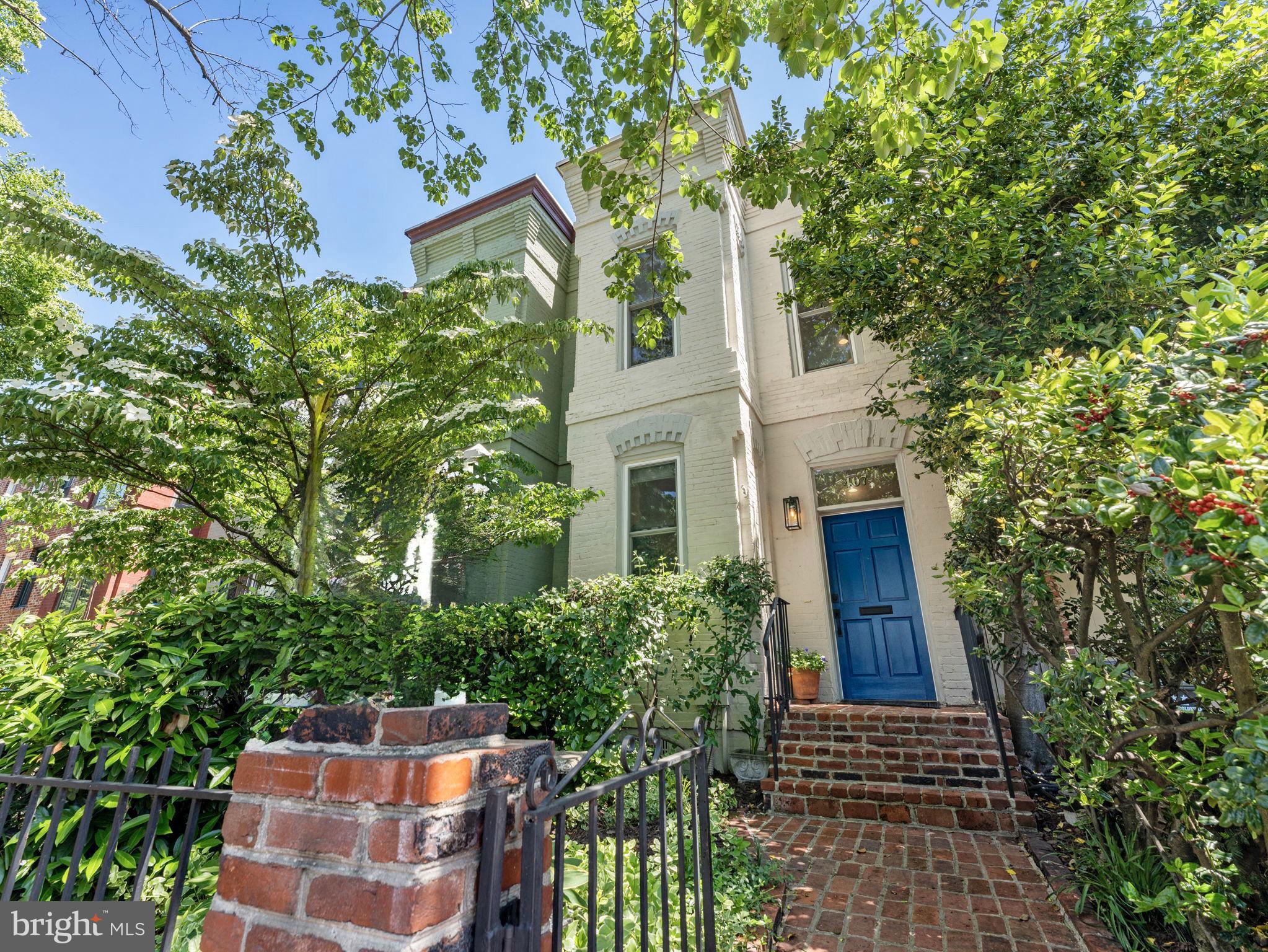 407 5th Street Northeast Washington, DC 20002 - Photo 1 of 41 a view of a house with brick walls and potted plants