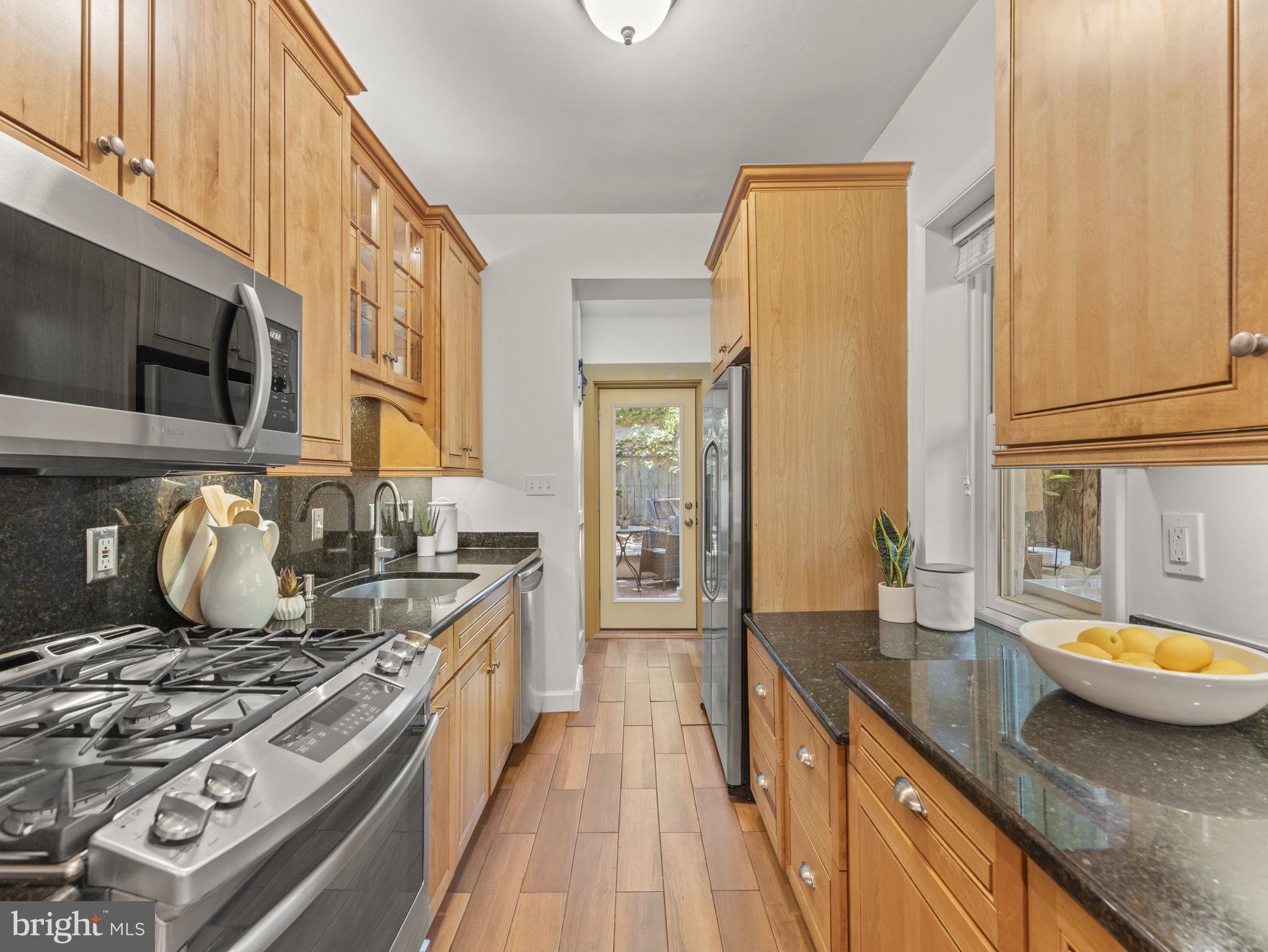 407 5th Street Northeast Washington, DC 20002 - Photo 11 of 41 a kitchen with a stove and a sink