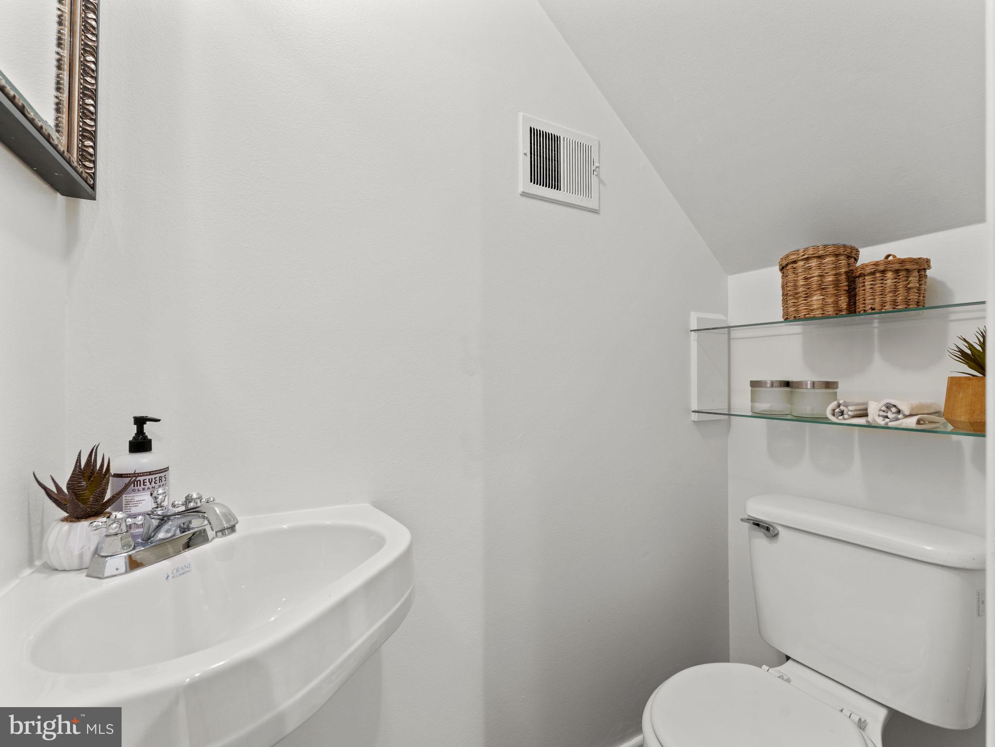 407 5th Street Northeast Washington, DC 20002 - Photo 17 of 41 a bathroom with a sink toilet and a mirror